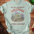 Light green t-shirt with frog wizard playing banjo and text "How am I supposed to Lollygag in these conditions?".