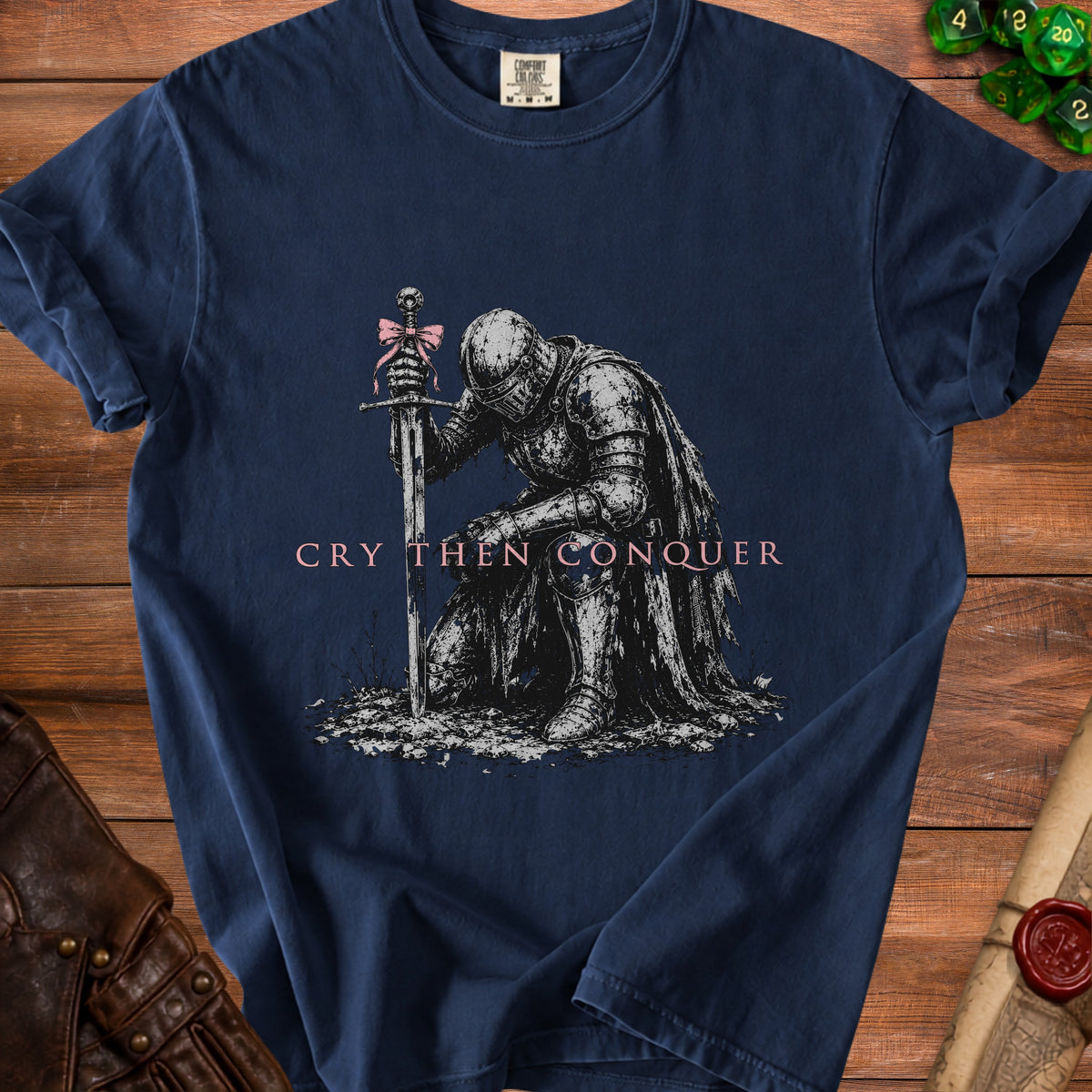 Dark blue t-shirt with knight graphic and "Cry Then Conquer" text.
