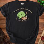 Black t-shirt with a cartoon frog, ghost, and bowl of mushrooms and text "I SUMMONED SNACKS. CLOSE ENOUGH."