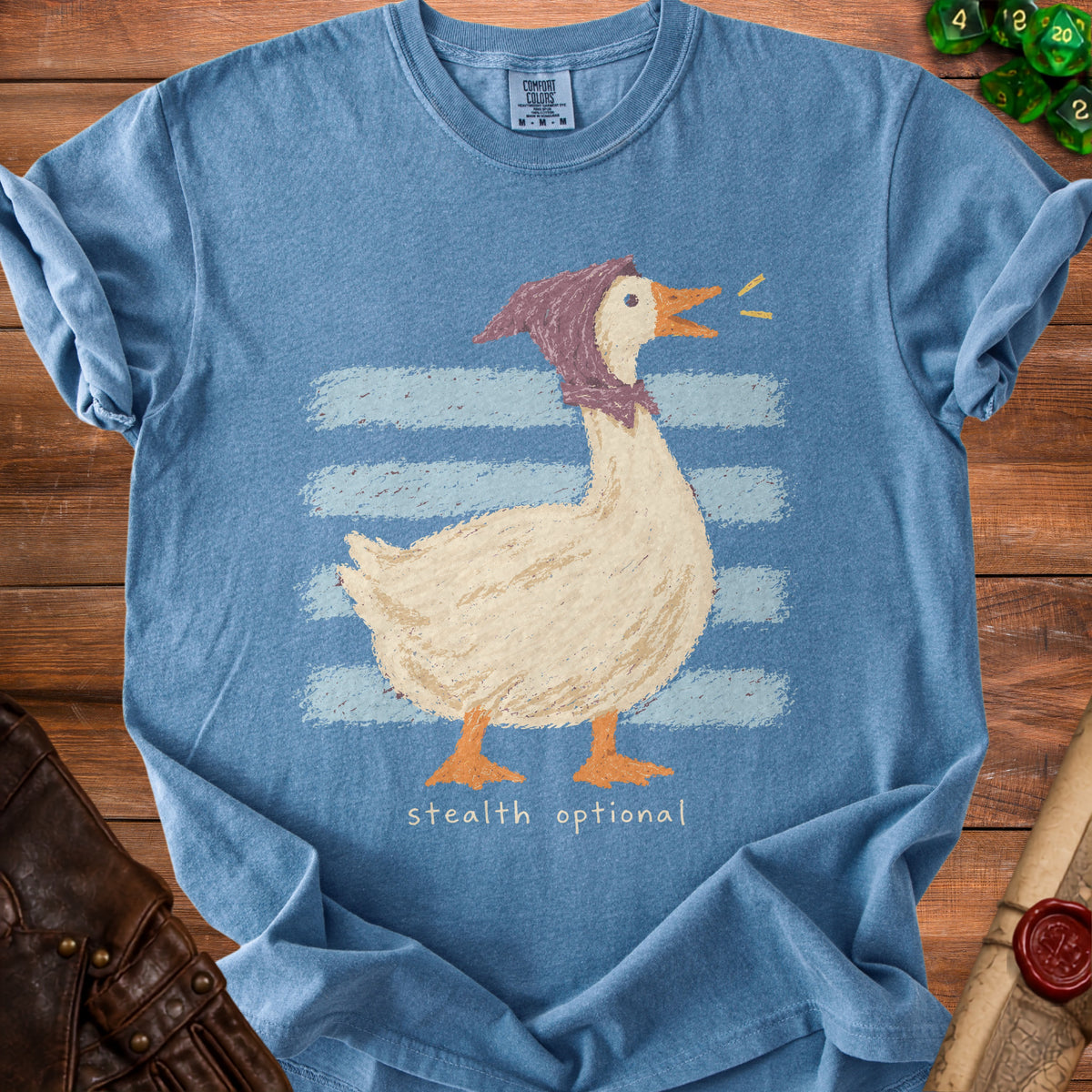 Blue t-shirt with a goose wearing a bonnet and the text "stealth optional".