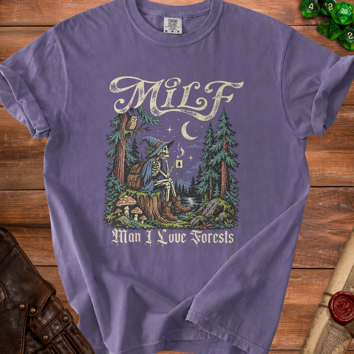 Purple t-shirt with skeleton witch and "MILF Man I Love Forests" text.