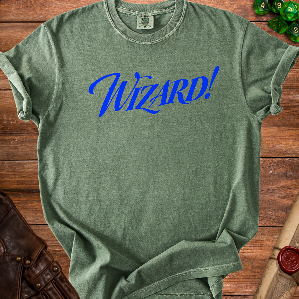 Green t-shirt with "Wizard!" in blue cursive text on the front.