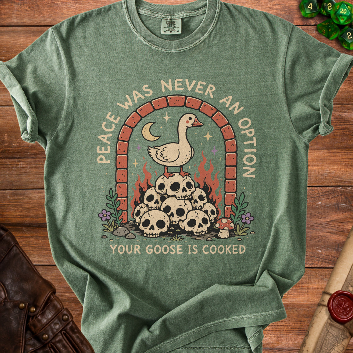 T-shirt with a goose standing on skulls under an arch, text reads "Peace was never an option, your goose is cooked".