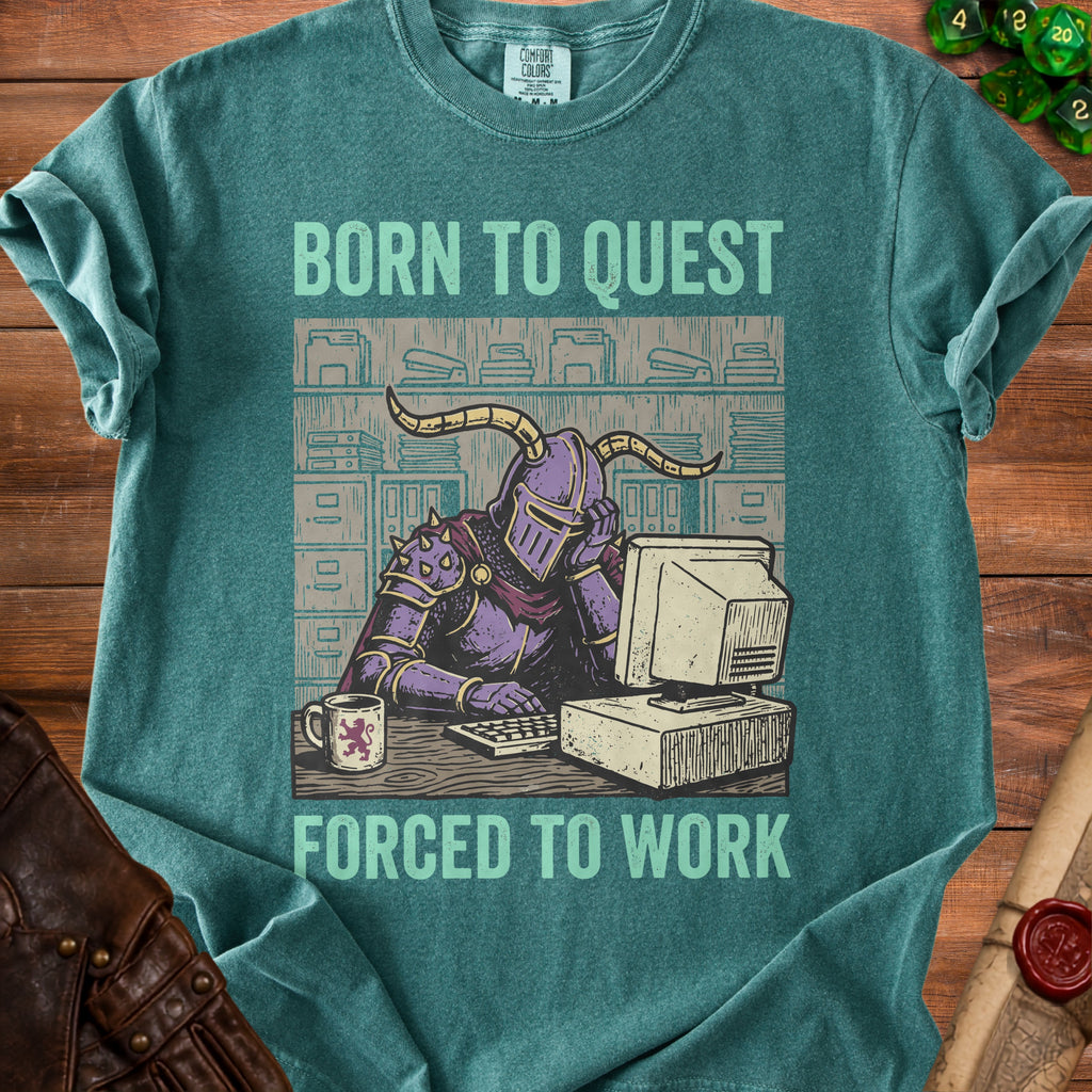 Green t-shirt with text "BORN TO QUEST FORCED TO WORK" and knight at a computer.