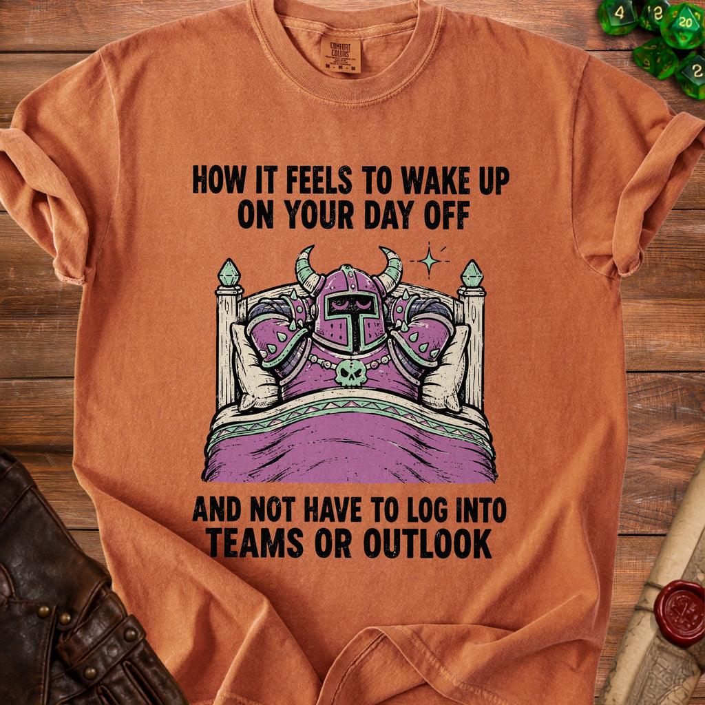 Orange t-shirt graphic: knight in bed, "How it feels to wake up on your day off and not have to log into Teams or Outlook."
