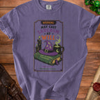 Purple t-shirt with "May Cast Sarcasm at Will" and witchy graphics.
