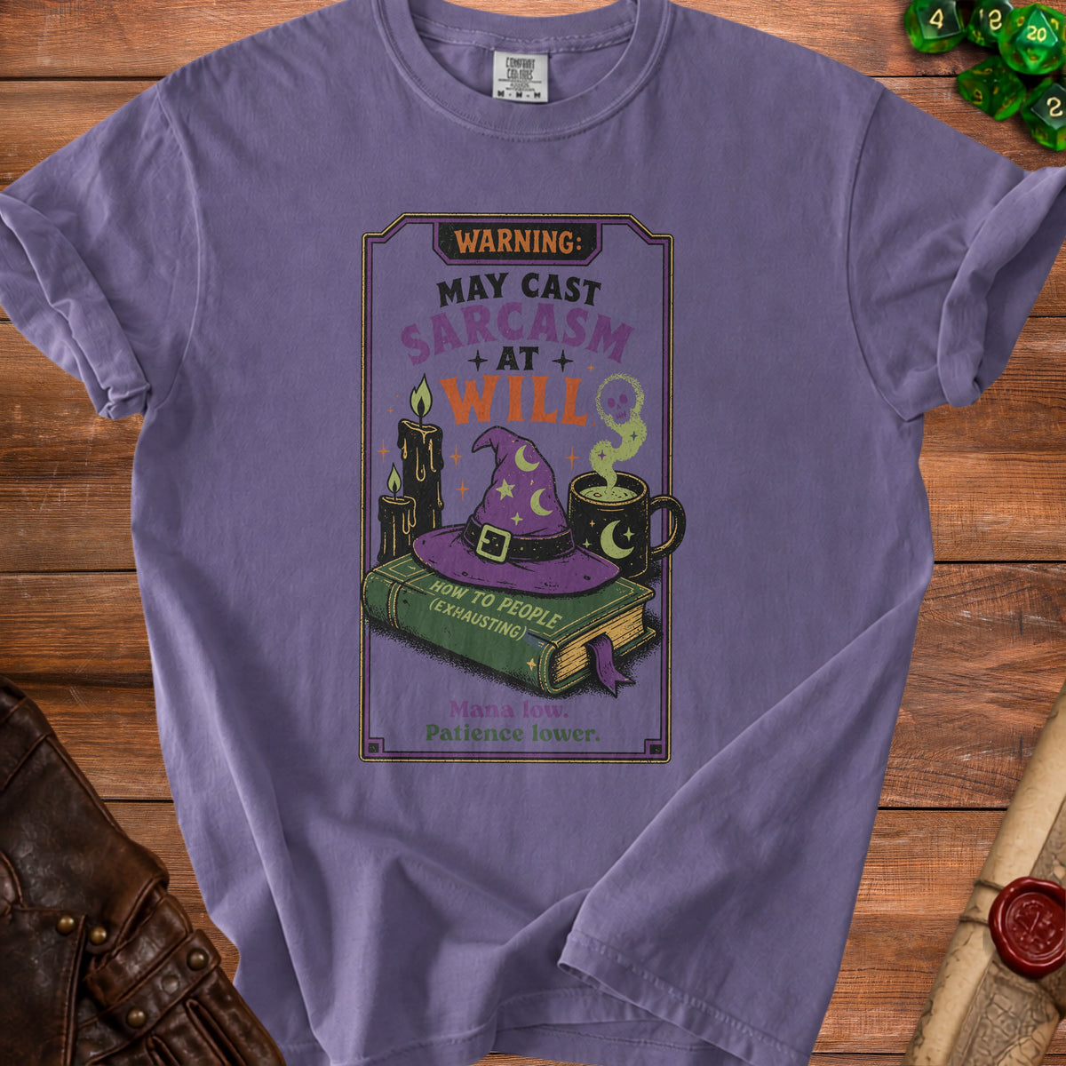 Purple t-shirt with "May Cast Sarcasm at Will" and witchy graphics.