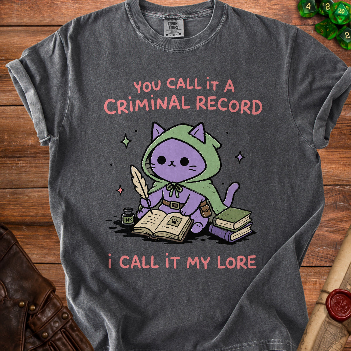 T-shirt with a purple cat in a green cloak writing in a book, saying "You call it a criminal record, I call it my lore".