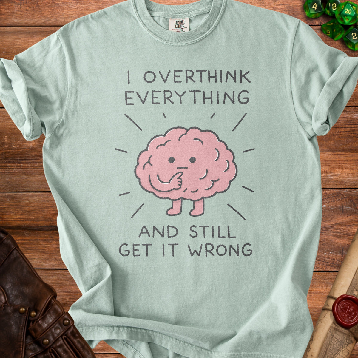 Light blue t-shirt with cartoon brain saying "I OVERTHINK EVERYTHING AND STILL GET IT WRONG".