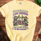 Yellow t-shirt with "Standard Lads Weekend" and goblins with swords.