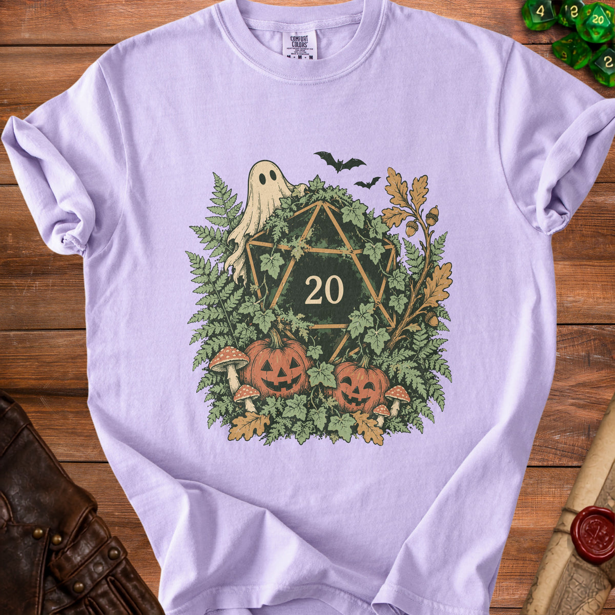 Lavender t-shirt with ghost, bats, pumpkins, and d20 dice Halloween graphic.