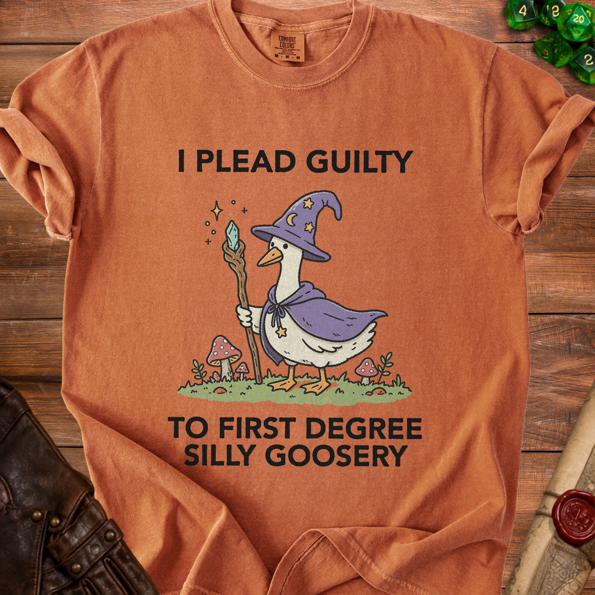 Orange t-shirt with a wizard goose graphic and text "I plead guilty to first degree silly goosery".