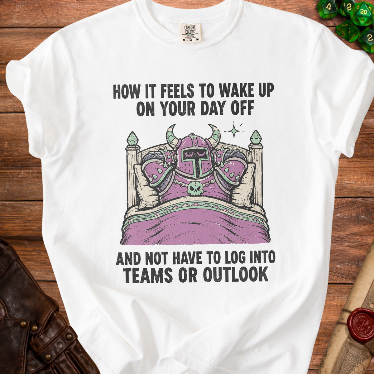 White t-shirt with graphic of a knight in armor in bed with text.