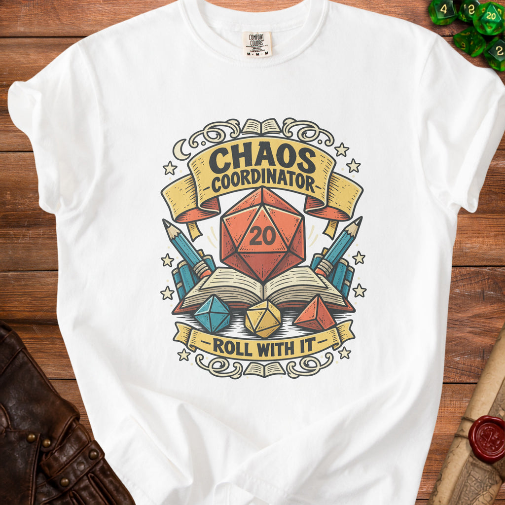 White t-shirt with "Chaos Coordinator Roll With It" text, dice, and books design.