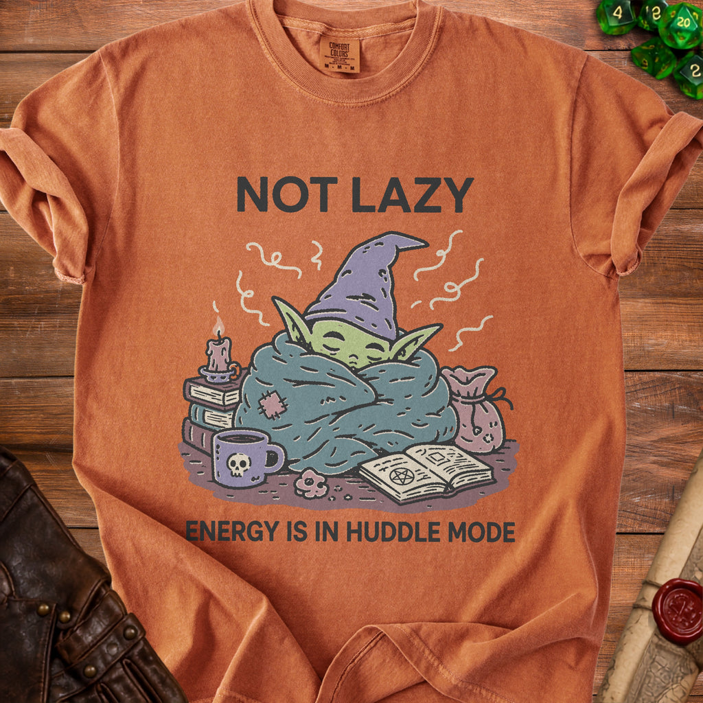Orange t-shirt with "NOT LAZY ENERGY IS IN HUDDLE MODE" and wizard character.