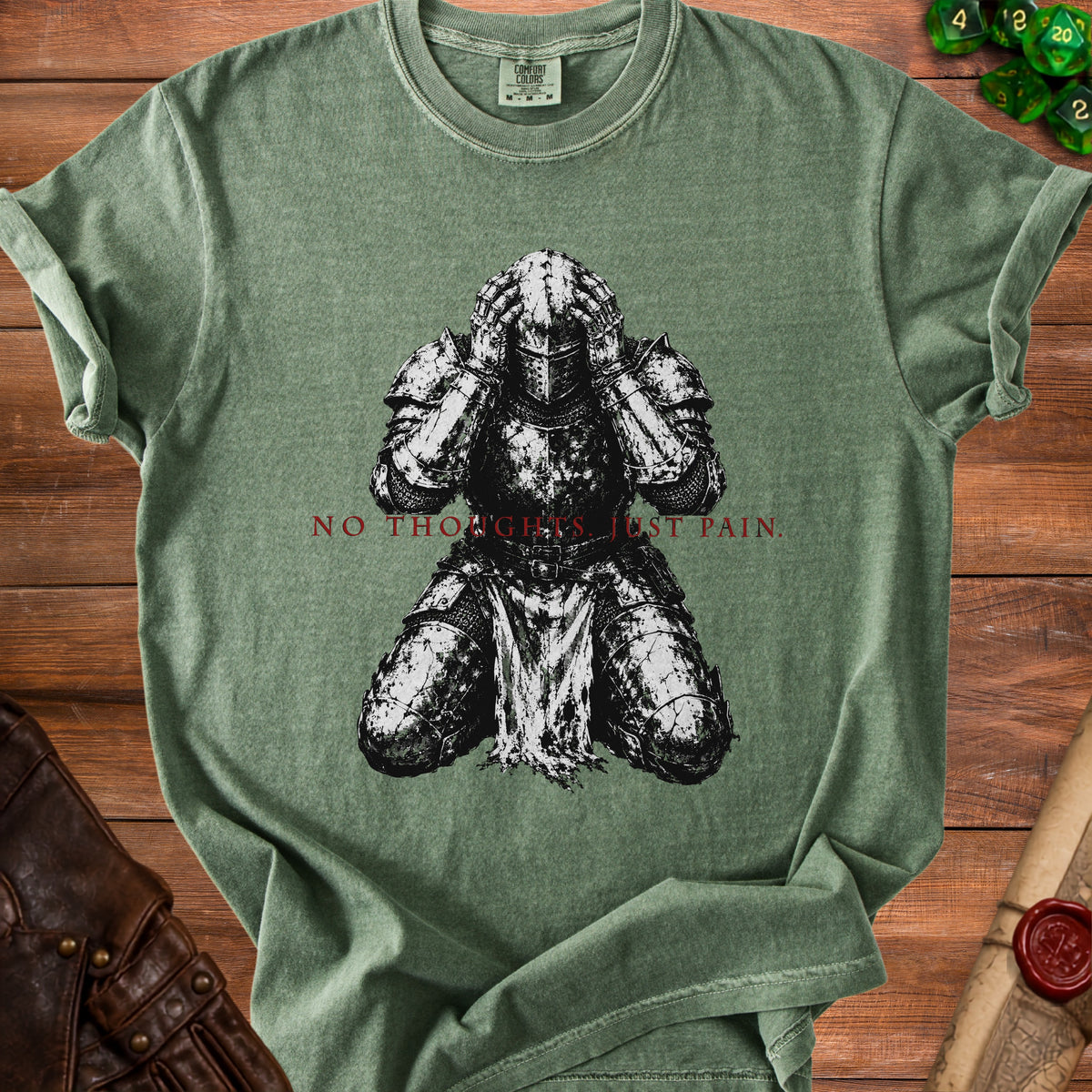 Green t-shirt with knight kneeling and text "NO THOUGHTS. JUST PAIN."
