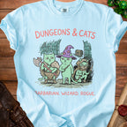 Light blue t-shirt with "Dungeons & Cats" text and barbarian, wizard, rogue cats.
