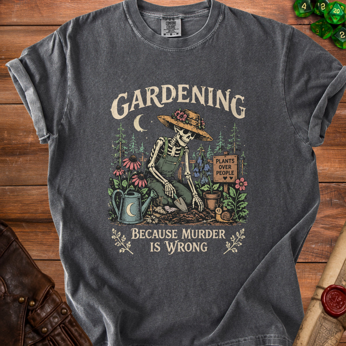 Dark gray t-shirt with skeleton gardening graphic and text "Gardening Because Murder Is Wrong".