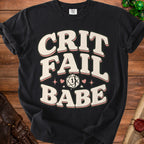 Black t-shirt with "CRIT FAIL BABE" and a cracked d20 dice graphic.