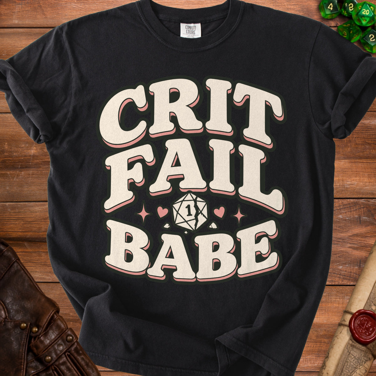 Black t-shirt with "CRIT FAIL BABE" and a cracked d20 dice graphic.