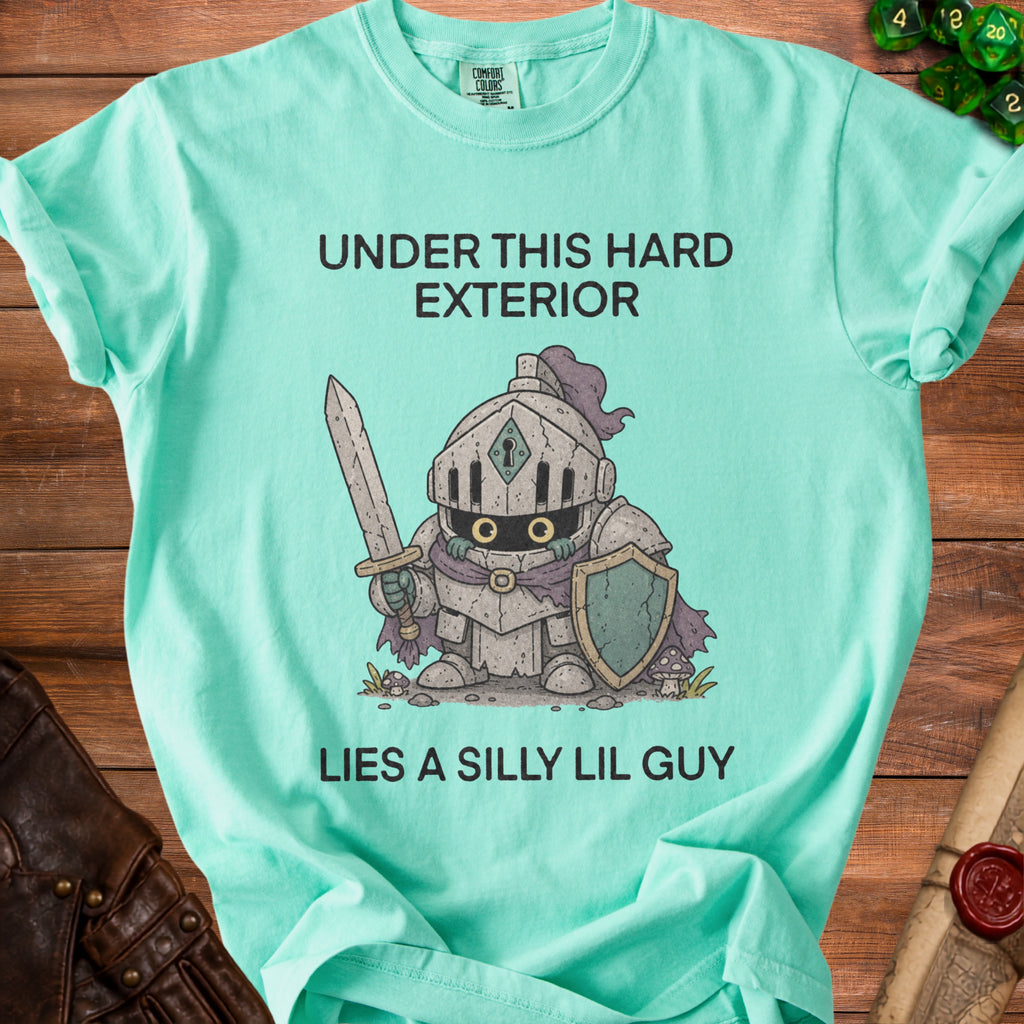 Aqua t-shirt with a knight illustration and text "UNDER THIS HARD EXTERIOR LIES A SILLY LIL GUY".