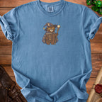 Blue t-shirt with a wizard bear graphic holding a book titled "Low Spell Slots".