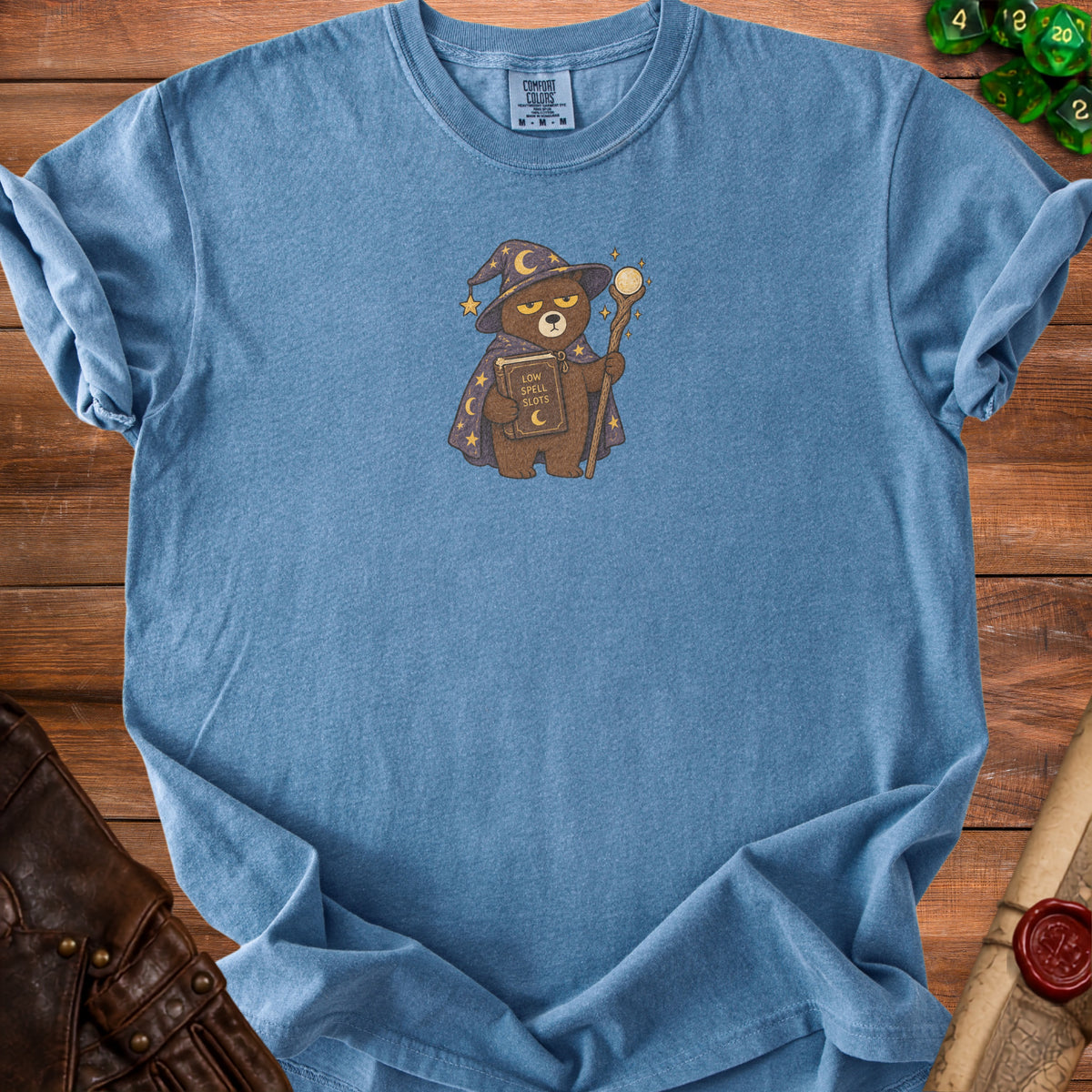 Blue t-shirt with a wizard bear graphic holding a book titled "Low Spell Slots".