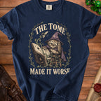 T-shirt with owl in wizard hat reading book with text "The Tome Made It Worse."