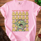 Pink t-shirt with a distressed graphic of a green monster and text "EVERYDAY MY HEAD GOES".