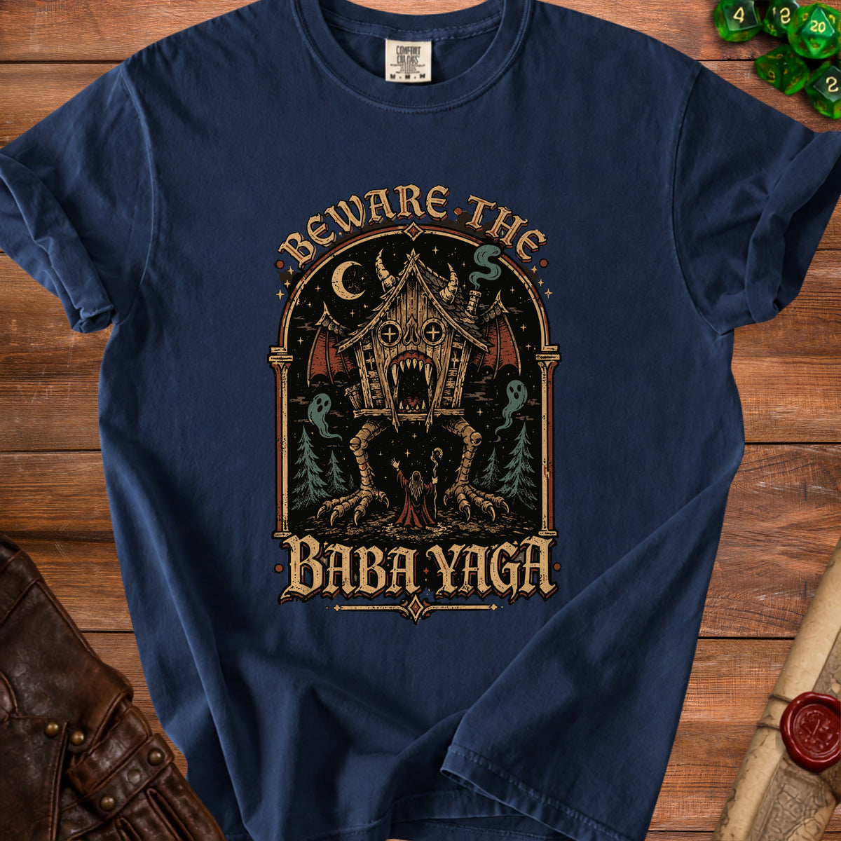 Navy t-shirt with "Beware The Baba Yaga" text and a spooky forest illustration.