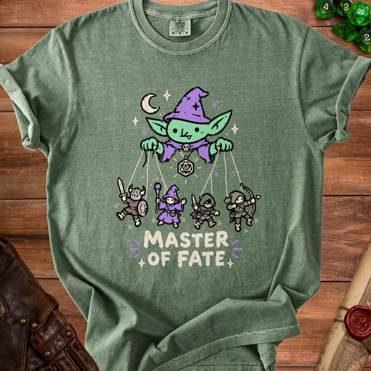 Green t-shirt with a goblin puppet master controlling four fantasy characters and the text "MASTER OF FATE".