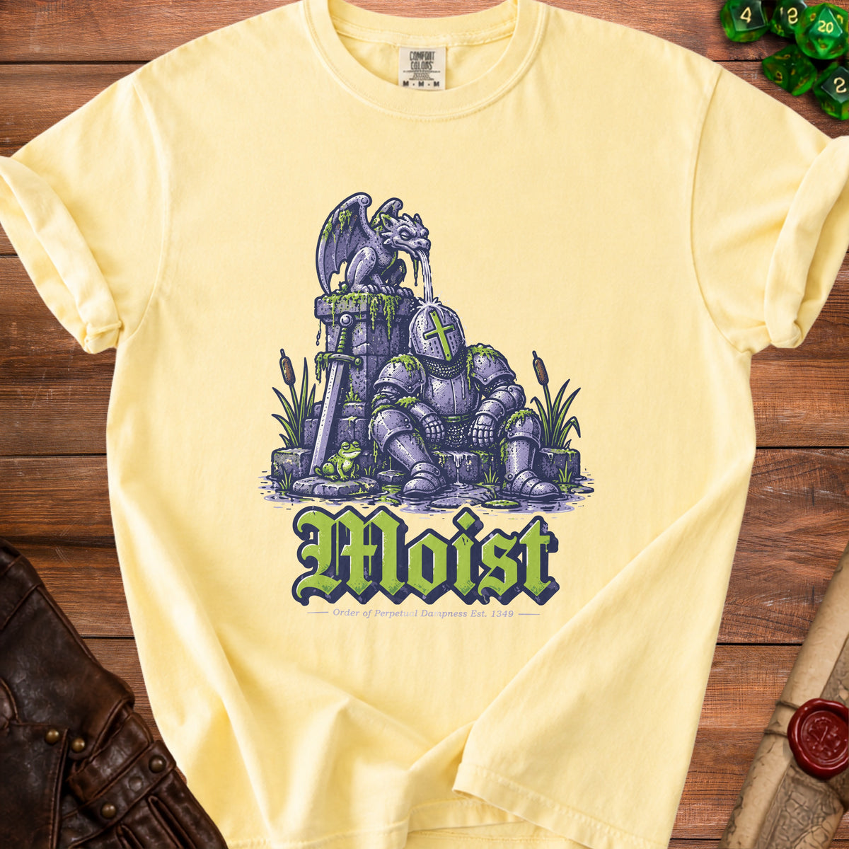 T-shirt with illustration of a knight receiving water from a gargoyle, text "Moist".