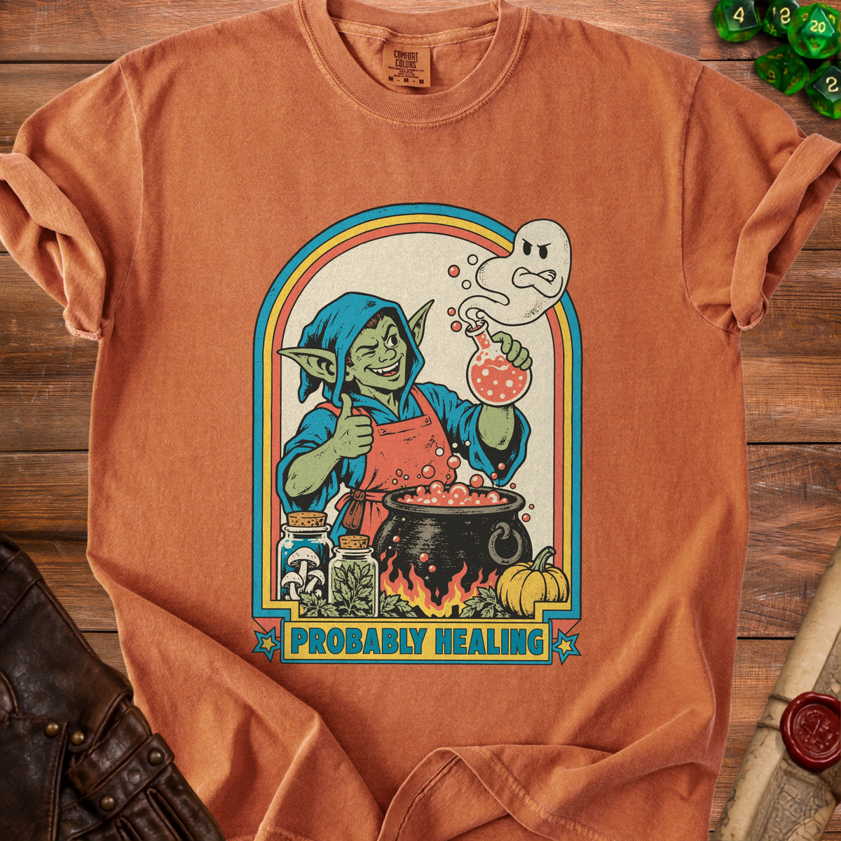 Goblin with potion and ghost, "PROBABLY HEALING" text, on an orange t-shirt.