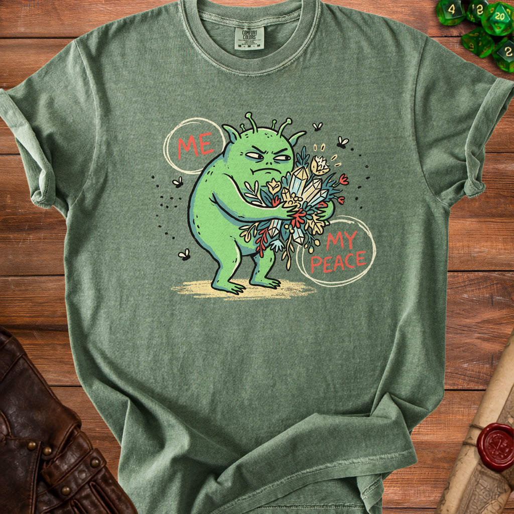 Green t-shirt with a grumpy alien holding "ME" and "MY PEACE" with flowers and crystals.