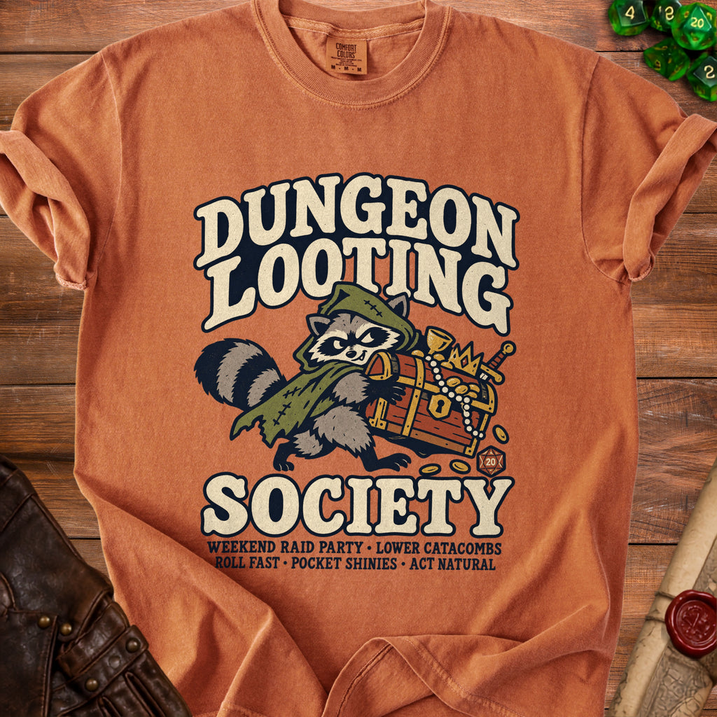 Orange t-shirt with a raccoon carrying a treasure chest, text reads Dungeon Looting Society