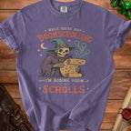 Purple t-shirt with skeleton wizard graphic and text "Doomscrolling I'm adding doom to my scrolls".