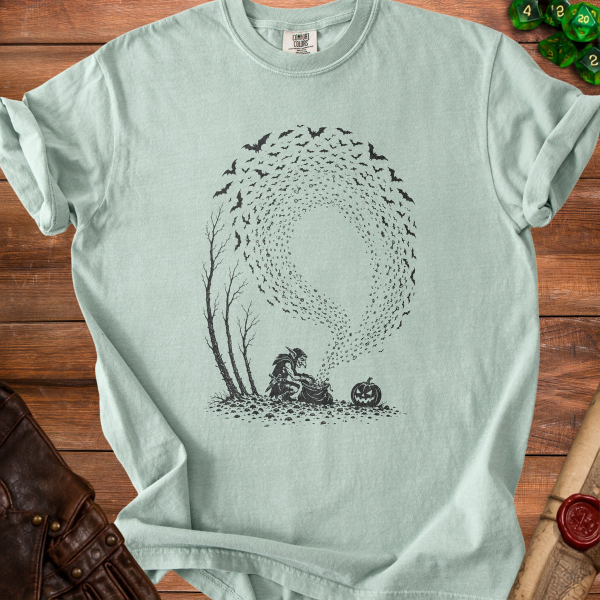 T-shirt with black ink drawing of a goblin, bats, and a pumpkin.
