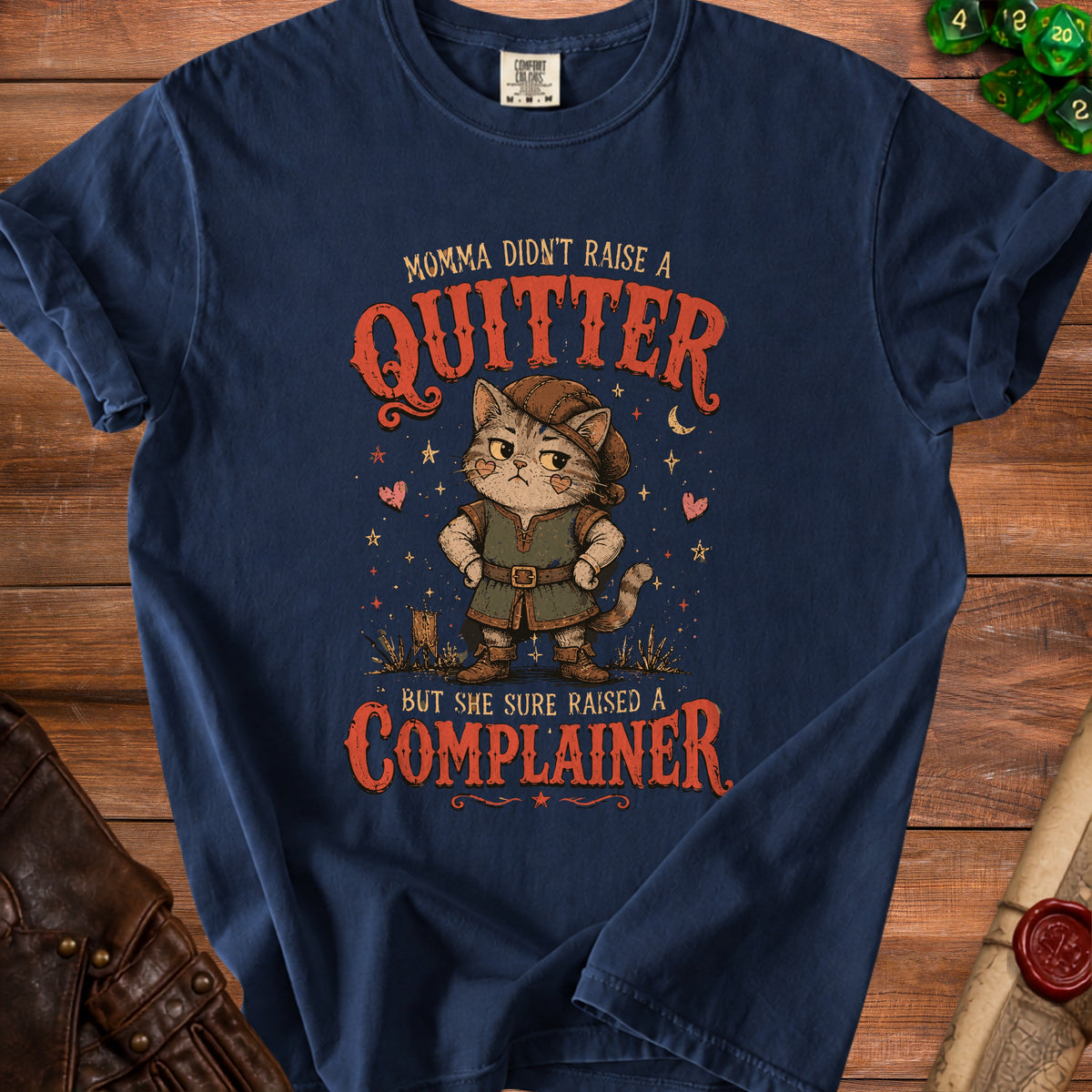 Navy t-shirt with "Momma didn't raise a quitter but she sure raised a complainer" and a cat.