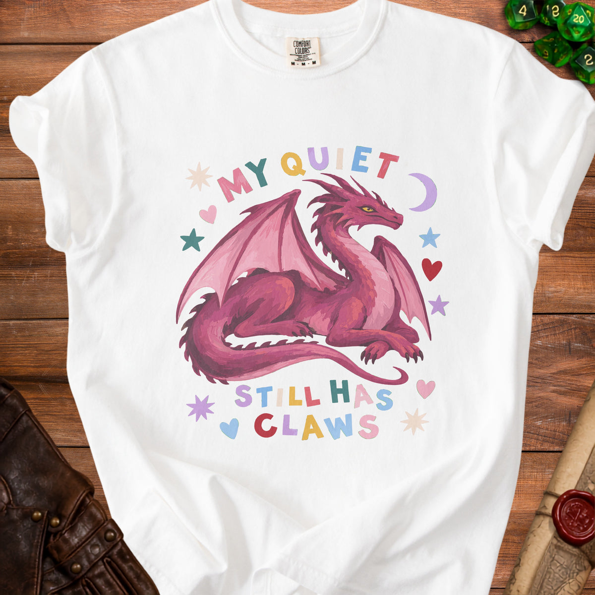 White t-shirt with a pink dragon graphic and the text "My Quiet Still Has Claws".