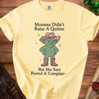 Yellow t-shirt with green goblin wearing cowboy hat and boots, saying "Momma Didn't Raise A Quitter But She Sure Raised A Complain".