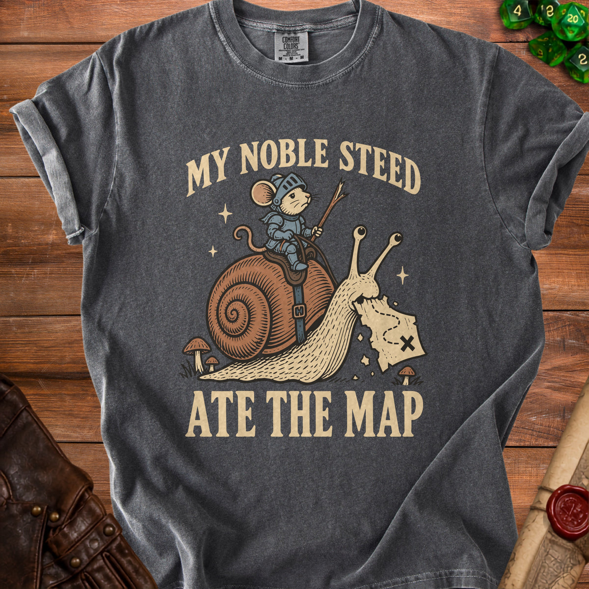 T-shirt graphic with a mouse knight riding a snail and eating a map.