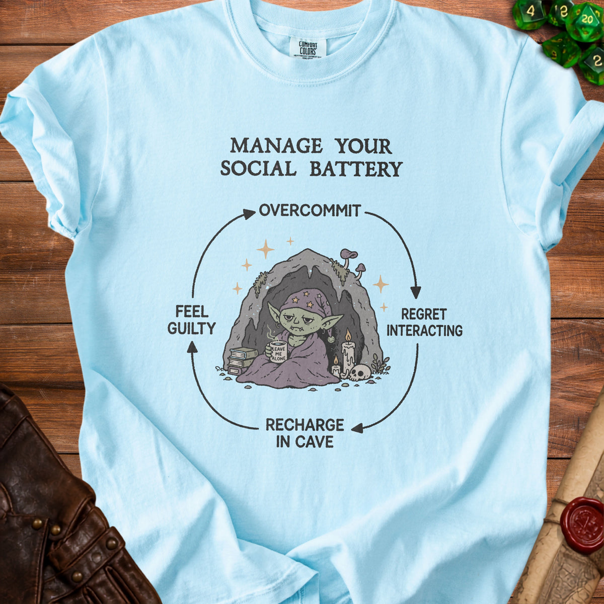 Light blue t-shirt with "Manage Your Social Battery" graphic and cycle diagram.
