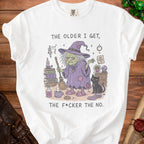 White t-shirt graphic with witch, black cat, books, and text "THE OLDER I GET, THE F*CKER THE NO."