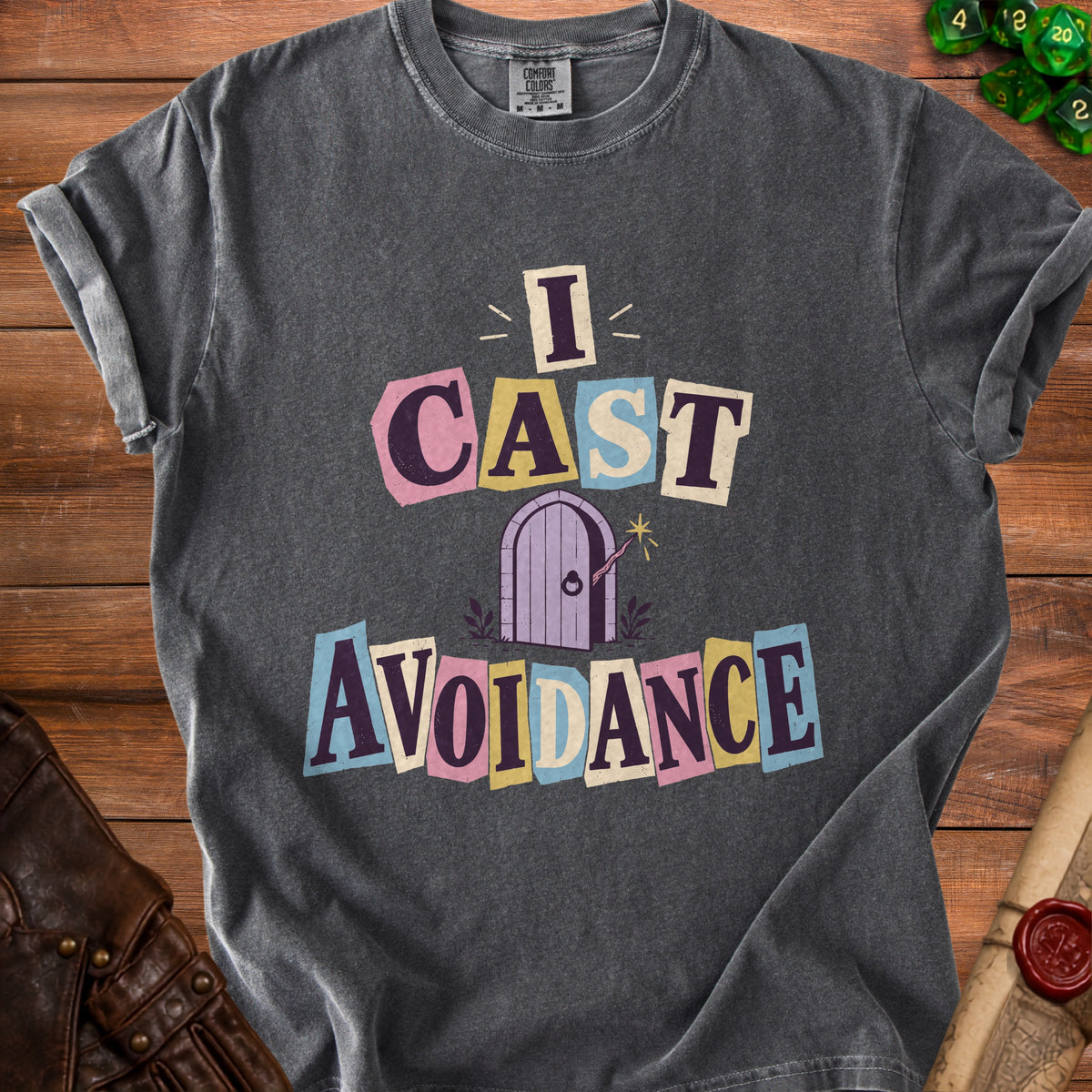 Grey t-shirt with text "I CAST AVOIDANCE" and a purple door graphic.