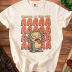 Cream t-shirt with cartoon monster and "EVERYDAY MY HEAD GOES AAAAA" text.