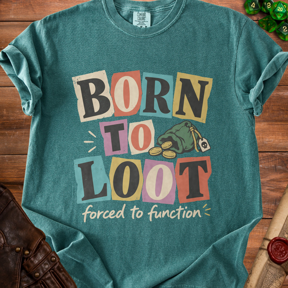 Teal t-shirt with "Born to Loot forced to function" text and a treasure bag graphic.