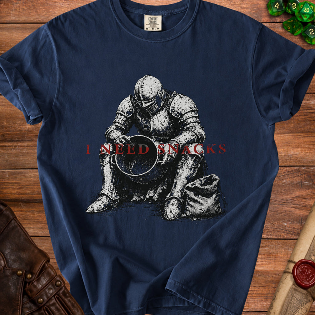 Knight in armor sitting with a bucket and bag, text "I NEED SNACKS".