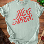 Light blue t-shirt with red distressed text "HEX APPEAL" and small stars.