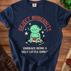 Navy t-shirt with a green goblin graphic and text "REJECT MODERNITY EMBRACE BEING A SILLY LITTLE GOBLIN".
