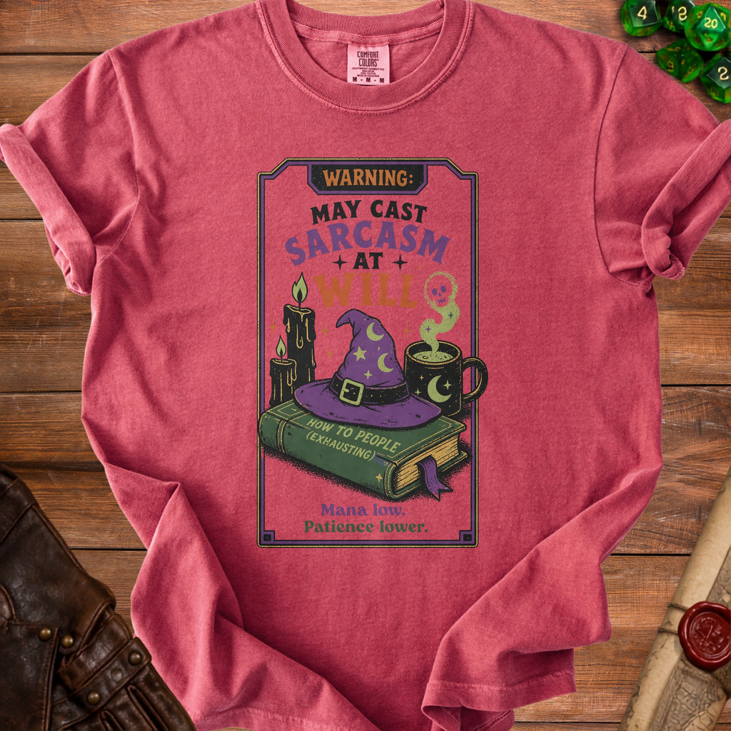T-shirt with "WARNING: MAY CAST SARCASM AT WILL" and witchy graphics.